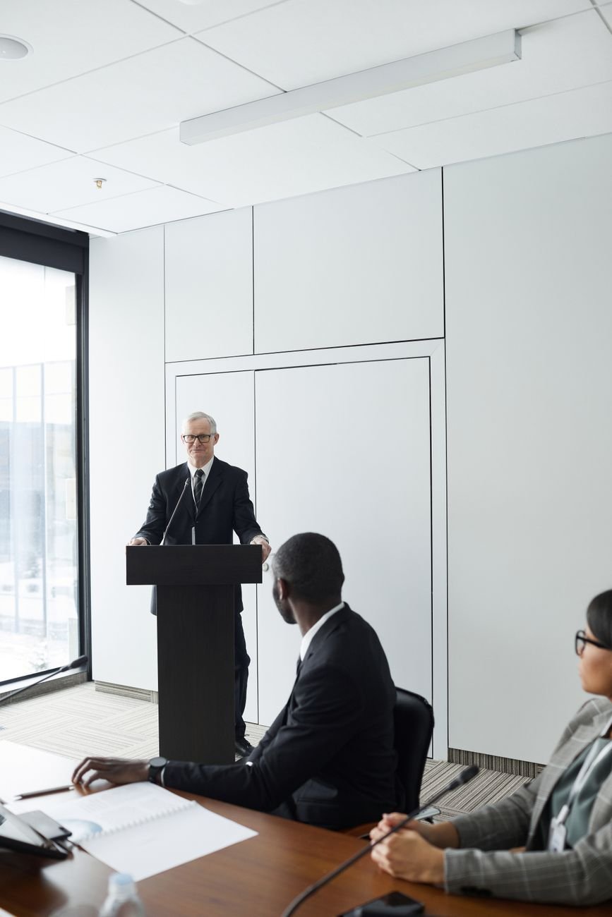 Professional business meeting with diverse discussion in a modern conference room.